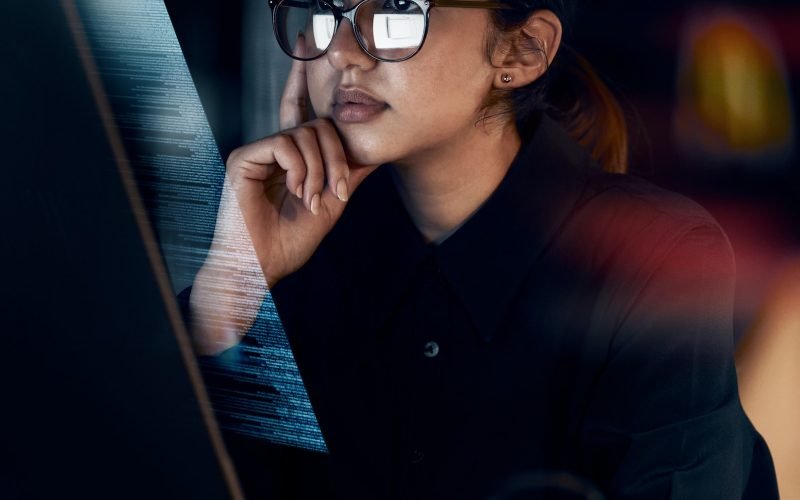 Programming, cybersecurity and thinking with woman at computer for software, idea and coding at nig