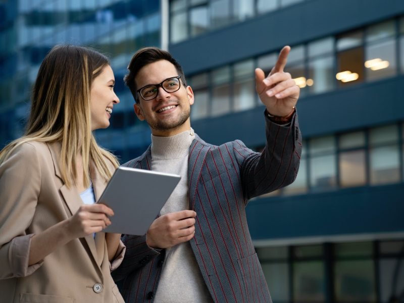 Successful business colleagues people working together on digital devices