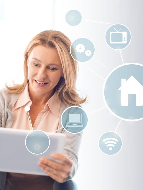pretty blonde woman using digital tablet, smart home concept
