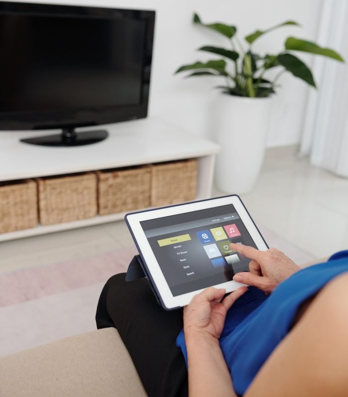 Senior Woman Using Smart Home App