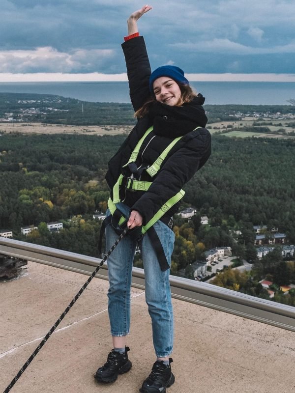 a-young-woman-walking-on-the-roof