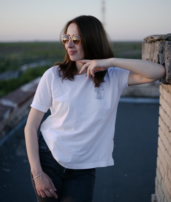 portrait of a young woman on the roof of the building