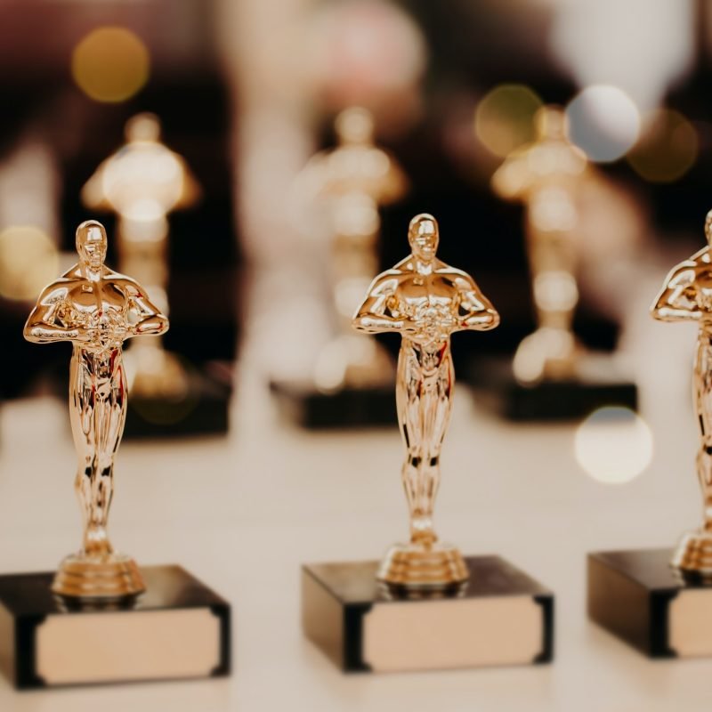 Oscar award. Prize for victory. Golden trophy,. Success concept. Horizontal shot