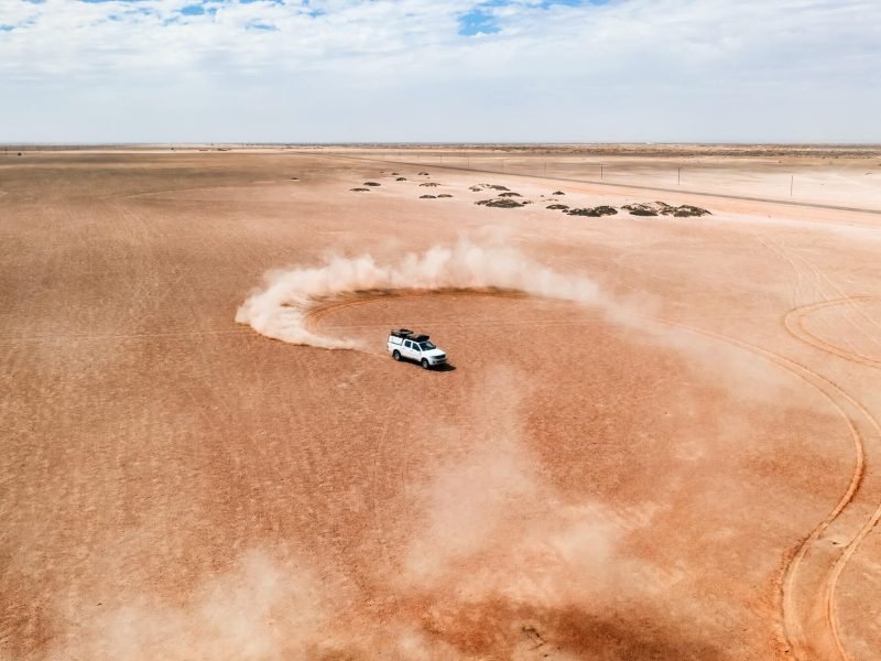 a-white-suv-car-dune-drifting-in-desert