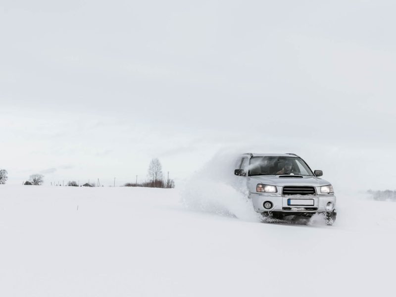 car-driving-on-snow-field