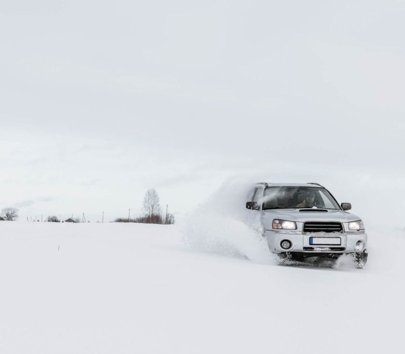 car-driving-on-snow-field