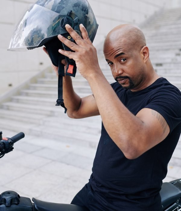 Mixed-race man sitting on bicycle