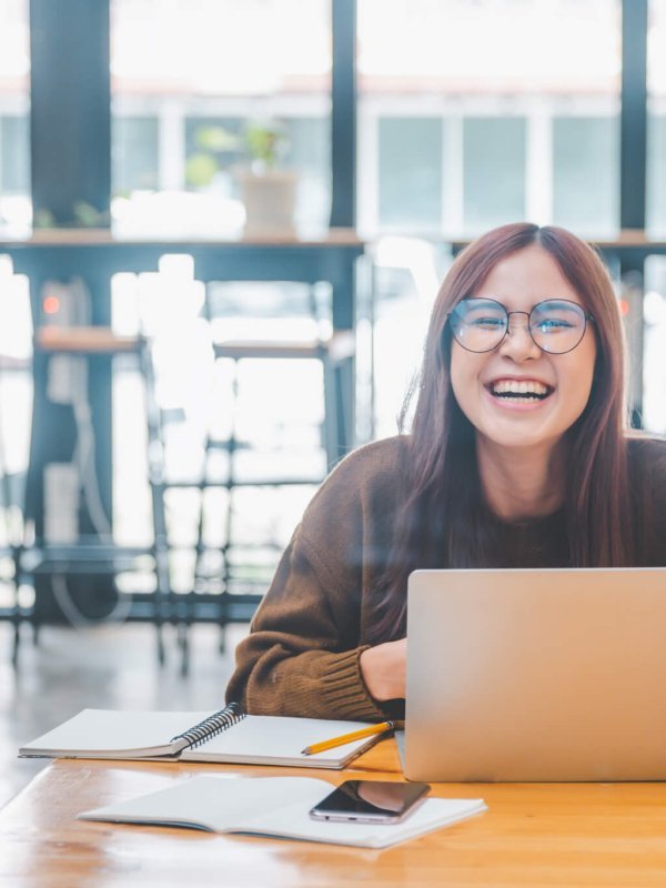 young student wearing headphones studies online, distance learning,
