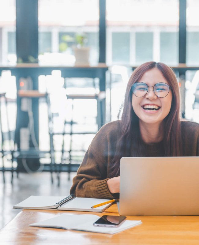 young student wearing headphones studies online, distance learning,