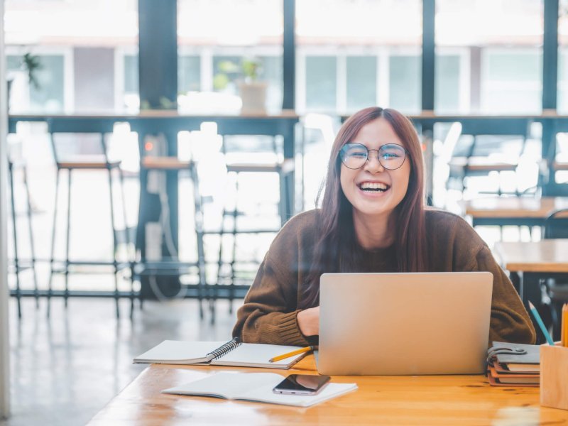 young student wearing headphones studies online, distance learning,
