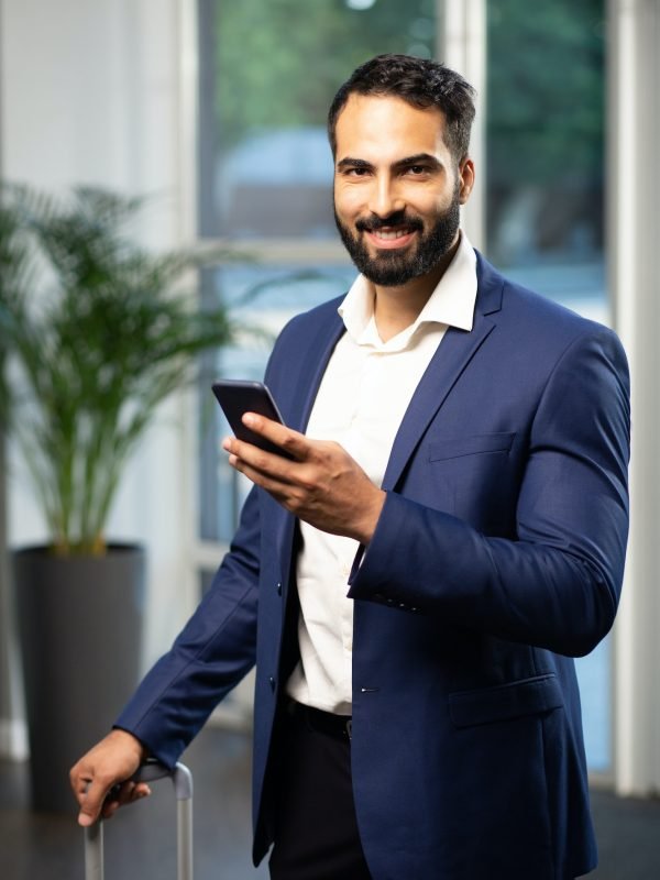 Successful office worker looking straight at camera