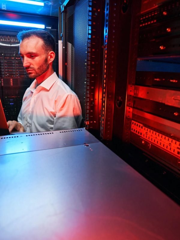 data-center-administrator-inspecting-server-rack-software