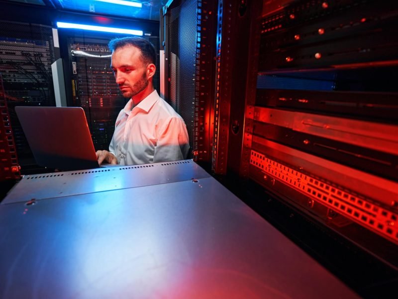 data-center-administrator-inspecting-server-rack-software