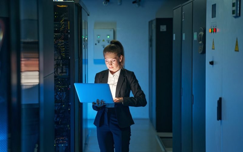 IT engineer specialist working in network server room