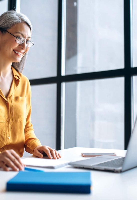 asian woman business online meeting virtual laptop mature