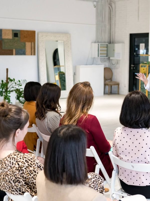 Coach having speech at business training.