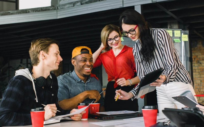 multiracial young creative people in modern office. Group of young business people are working