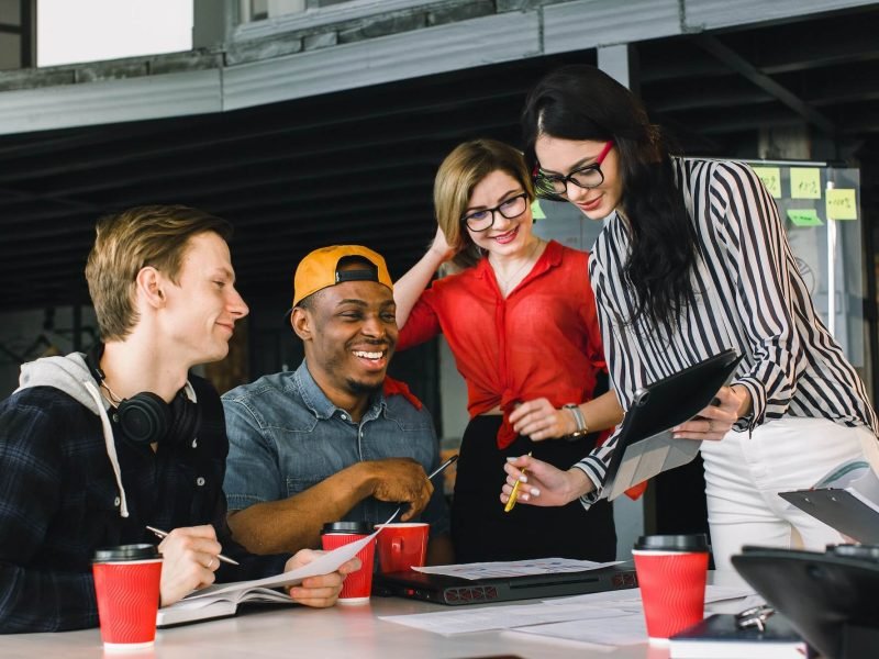 multiracial young creative people in modern office. Group of young business people are working